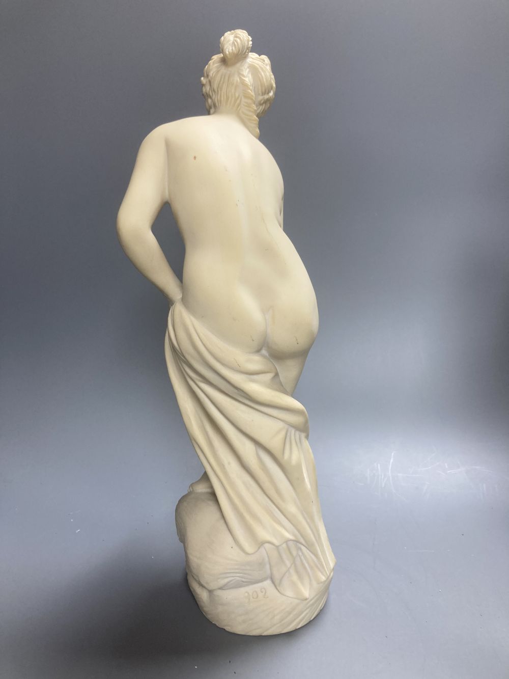A Copeland Parian figure of a winged maiden and a later composition figure of Venus bathing, H 43cm